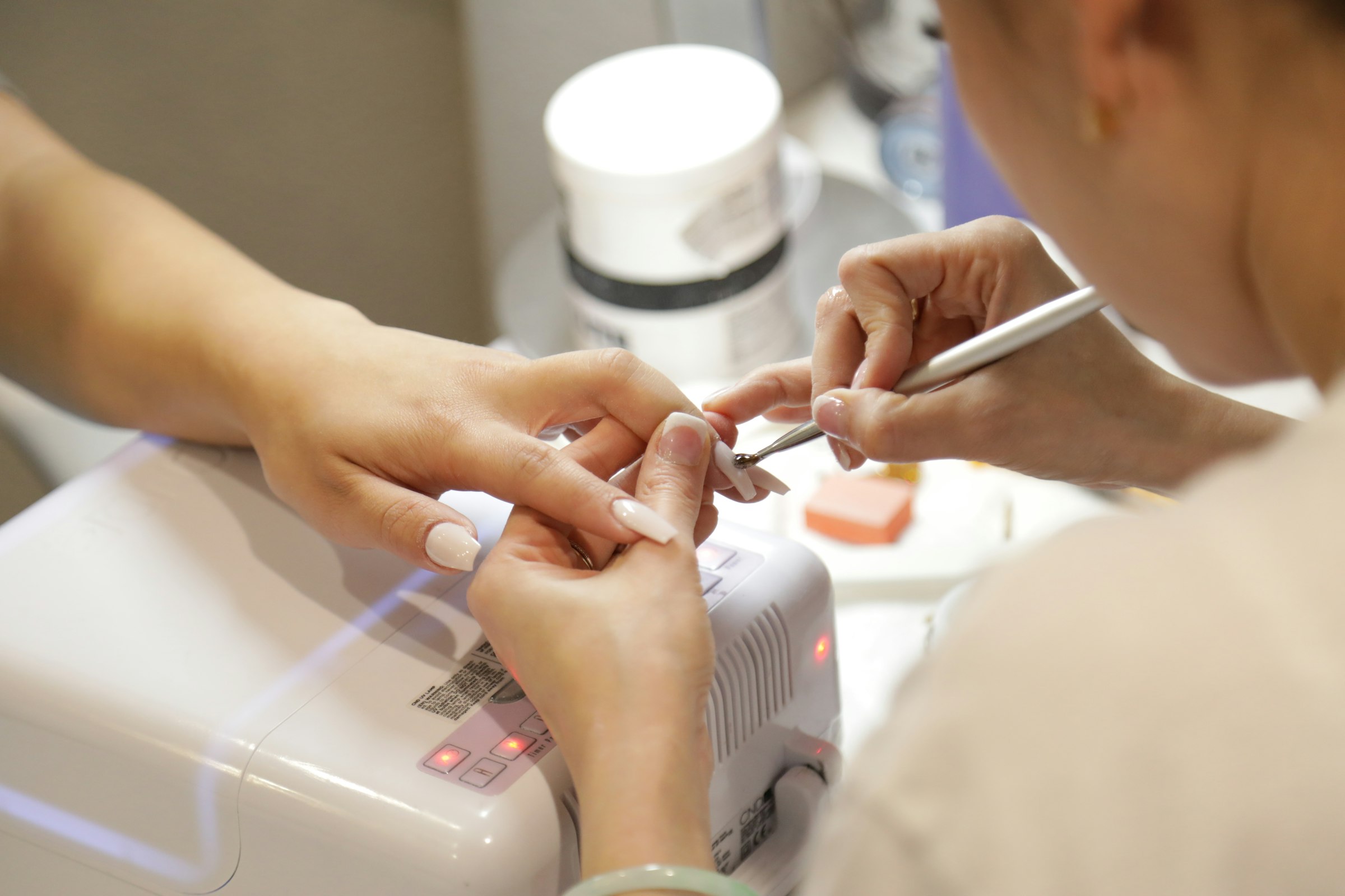 Nail technician giving a manicure